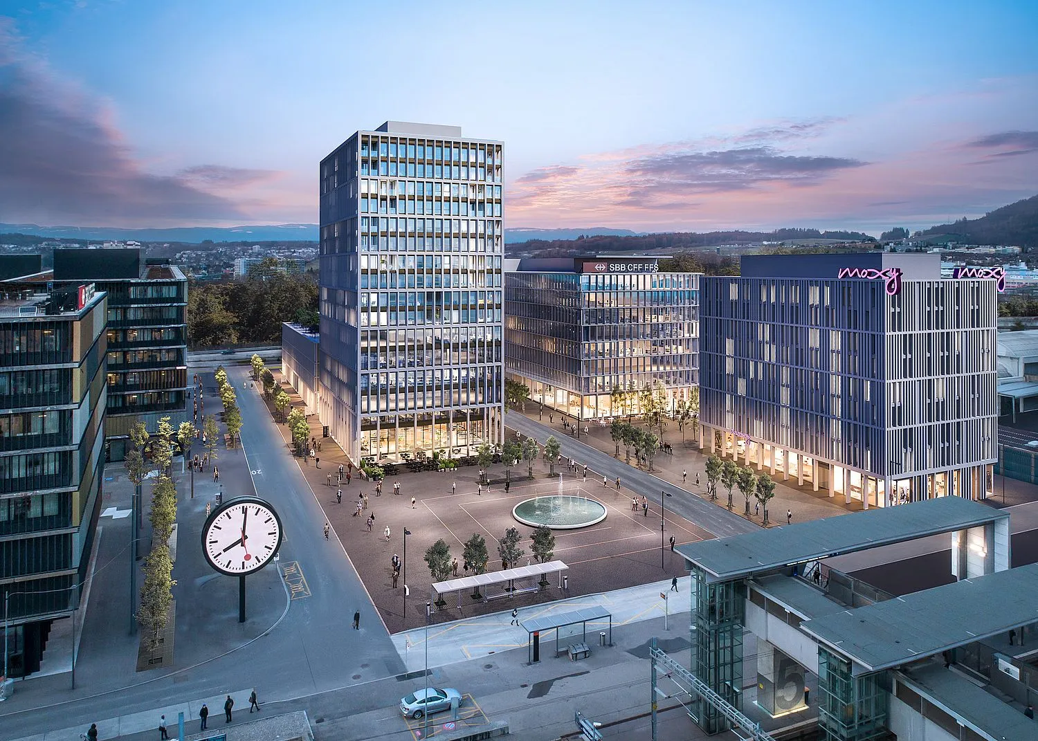 Trio Wankdorf in Bern mit Hochhaus und Platz in der Abenddämmerung